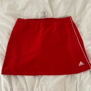 red adidas skirt with shorts.